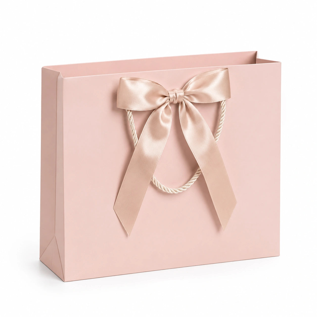Sac cadeau 30 x 12 x 28 cm en papier rose avec poignées en corde et nœud décoratif